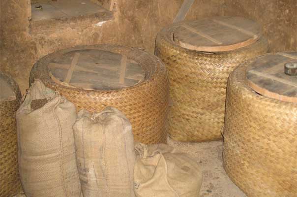 Grains in bamboo containers and gunny bags