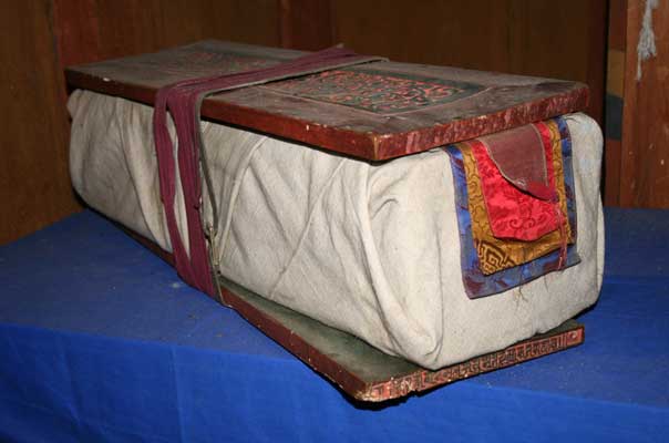 Book covered with cloth and wooden boards